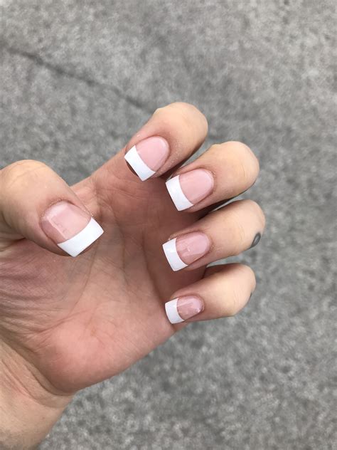 Ditch the traditional style and upgrade your French tip game. . Short french tip acrylic nails